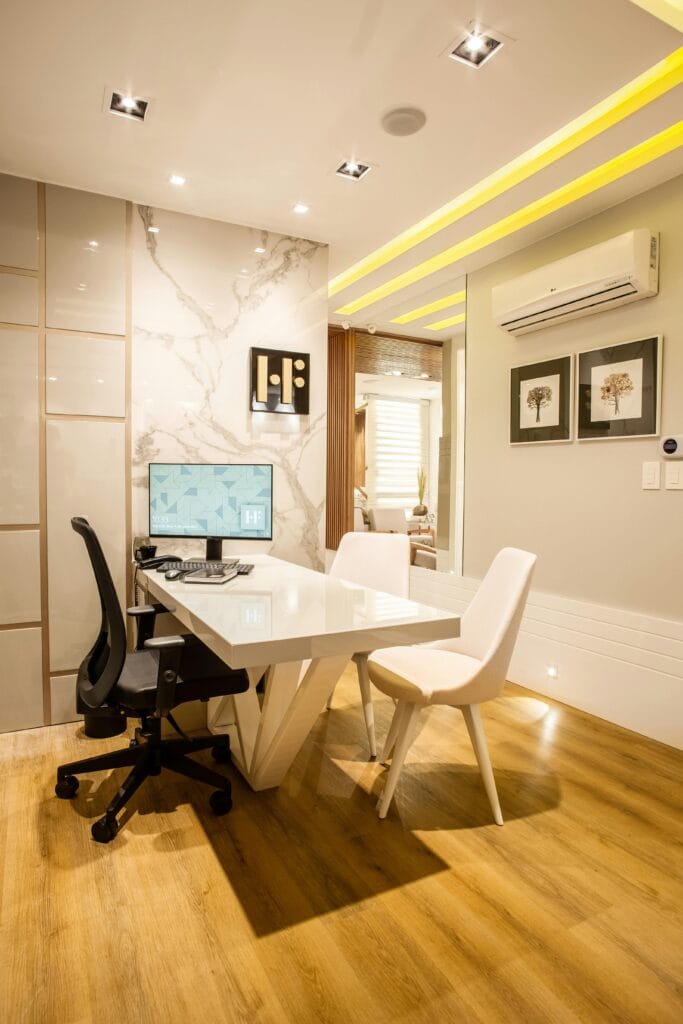 pexels-photo-3316924-3316924 Elegant modern office interior featuring a sleek desk, chairs, and ambient lighting for a sophisticated environment.