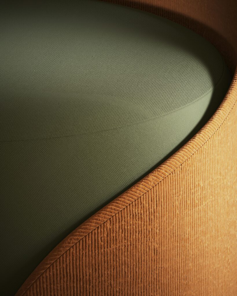 pexels-photo-10919579-10919579 Close-up of a modern armchair showcasing its textured fabric and sleek design.