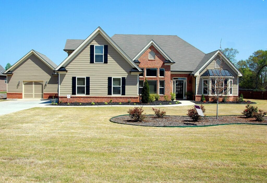 pexels-photo-209296-209296 Elegant suburban family house with large lawn and driveway, ideal for real estate listings.