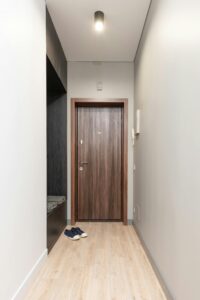 pexels-photo-6487955-6487955 Explore this serene and modern apartment hallway featuring minimalist decor with wooden accents.