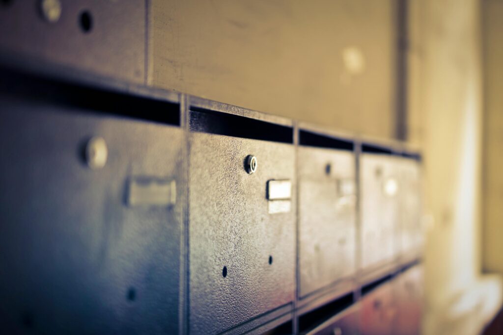 pexels-photo-948362-948362 A close-up shot of vintage metal mailboxes indoors with a soft blur effect.