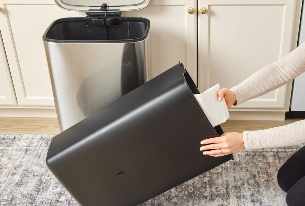 cleaning a trash can