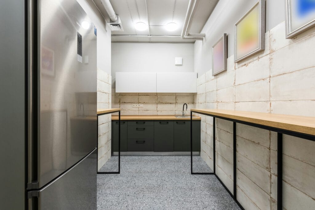 pexels-photo-7534183-7534183 A contemporary kitchen with clean lines, a neutral color palette, and wooden countertops.