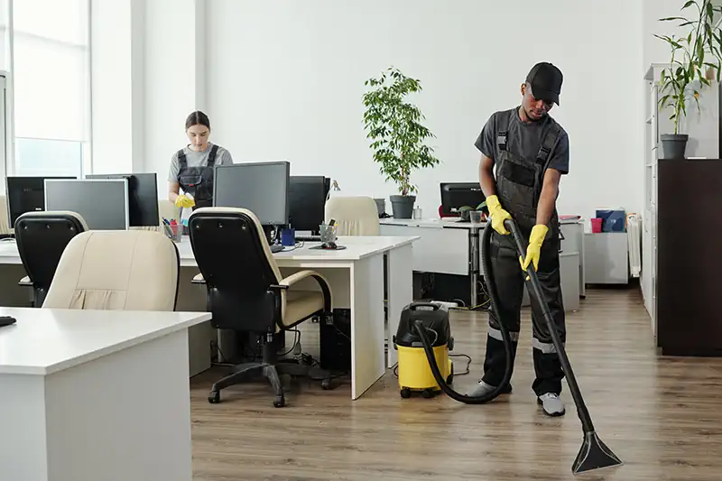 vacuuming the office